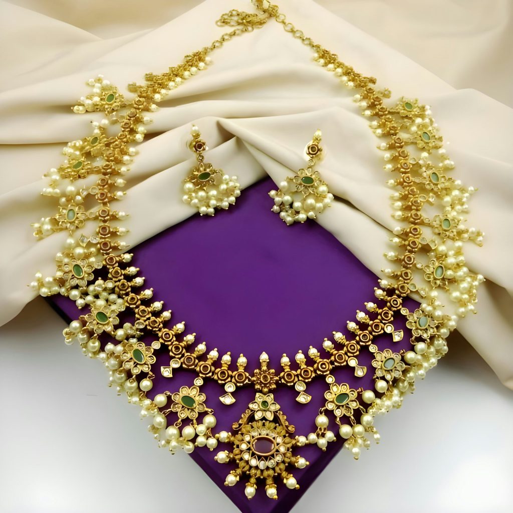 A purple and gold necklace and matching earrings